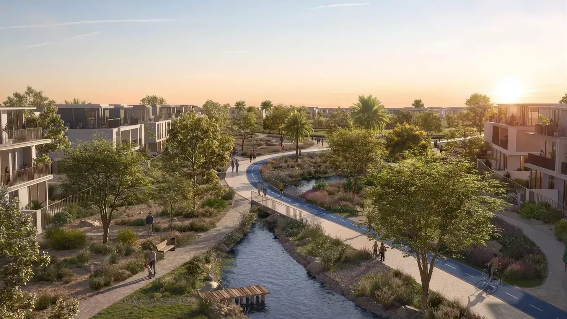 Rendering of low-rise homes beside a landscaped canal in a Dubai community
