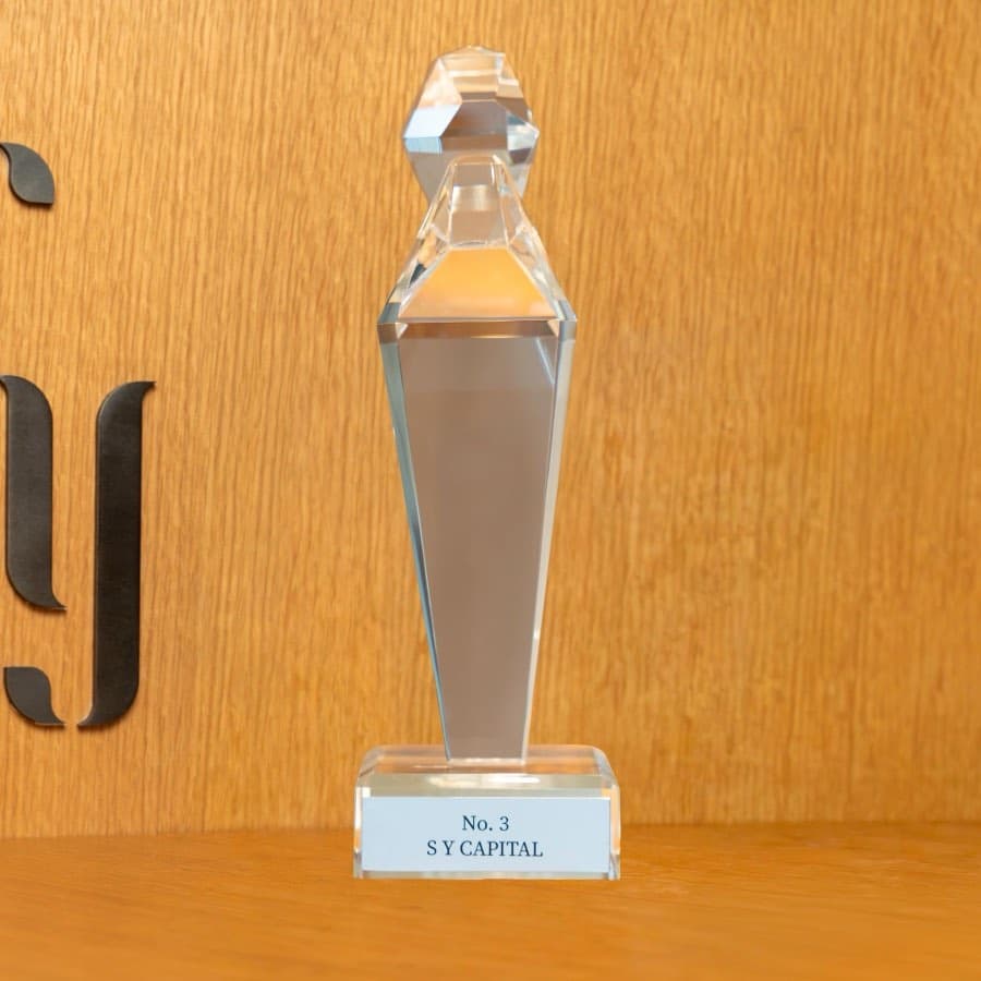 The Emaar Half-Decade Excellence Award crystal trophy, engraved No. 3, awarded to SY Capital