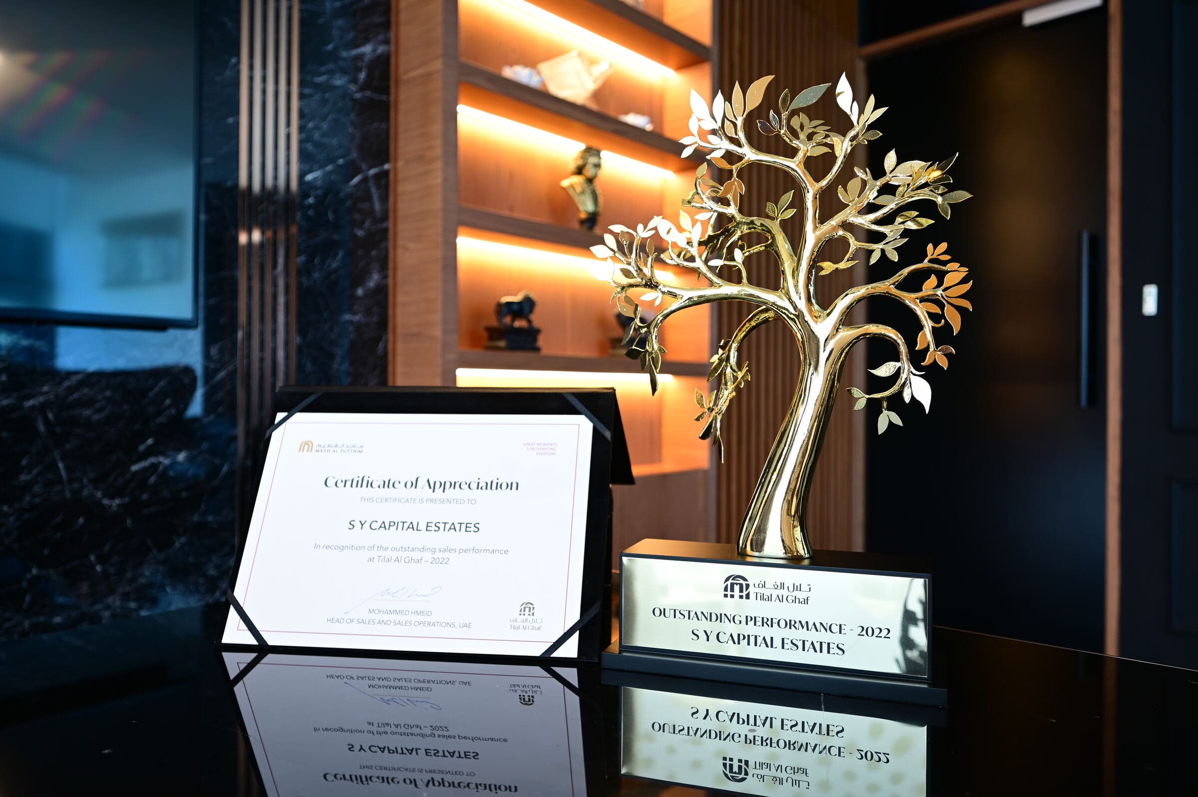 The Tilal Al Ghaf Outstanding Performance 2022 trophy and certificate of appreciation awarded to SY Capital Estates